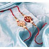 Red round kundan stone with beads rakhi with flower rakhi