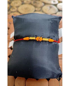 Red stones with light colour wooden beads rakhi