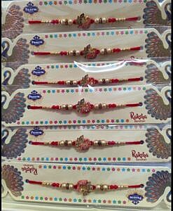 Red peacock rakhi with chawal chandan tika pack