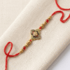 Four petals flower rakhi with chawal chandan tika pack