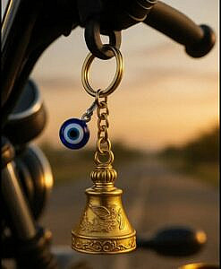 Golden gradian bell key ring with evil eye charm