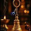 Golden gradian bell key ring with evil eye charm