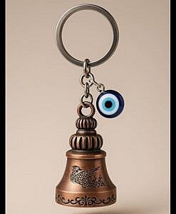 Copper colour gradian bell key ring with evil eye charm