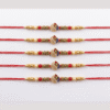 Round jali design with red and blue mor pankh rakhi
