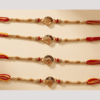 Oval with red round swastil rakhi