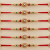 Beautiful small square design rakhi with red beads
